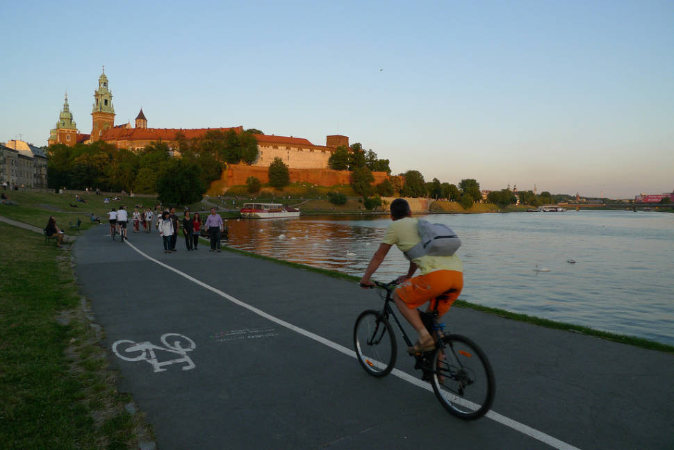 Cycling in Bulwar Kurlandzki on Vistula River close to Krakow Castle