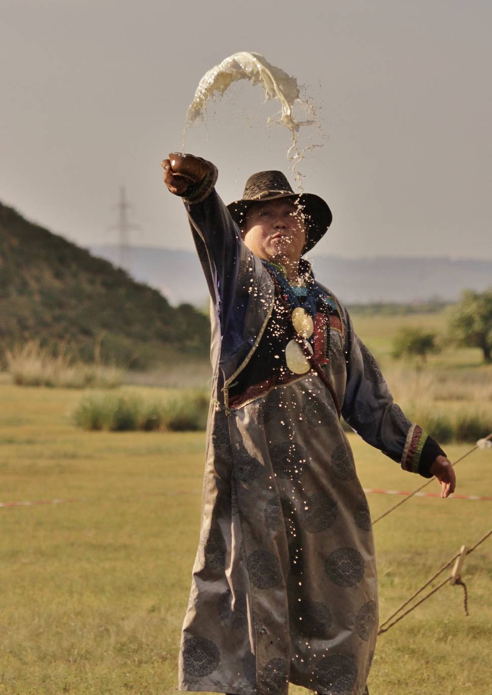 Shaman makes offerings to the local spirits
