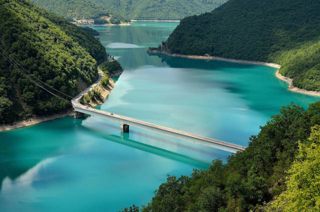 View on colourful Pivsko Jezero, from where the road starts through Durmitor
