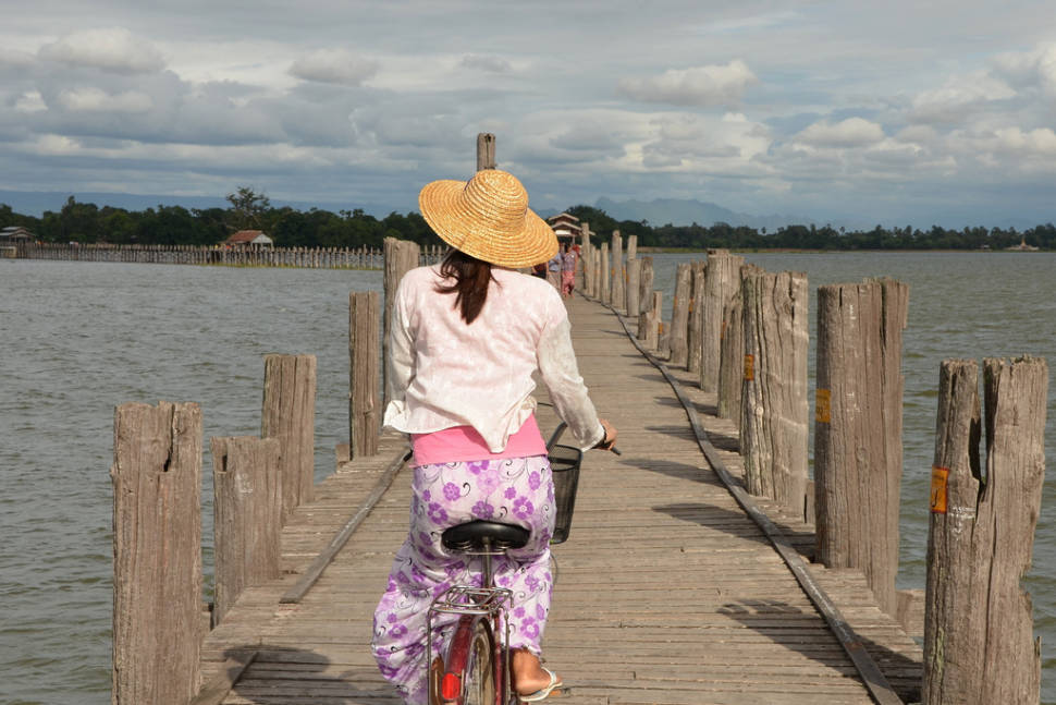 Cycling across the U Bein Bridge