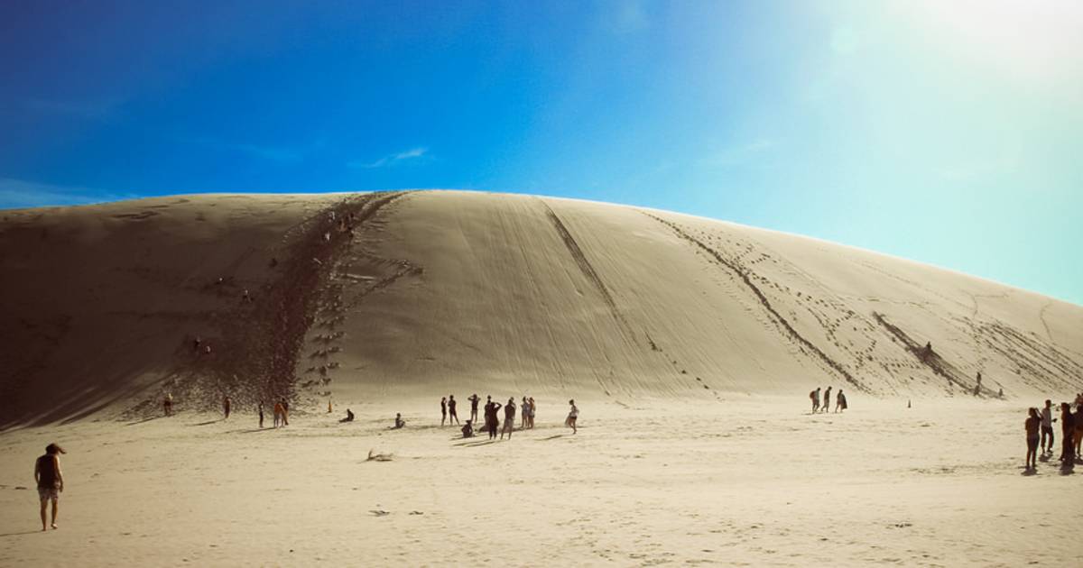 Body Board Down the Sand Dunes in New Zealand - Best Time