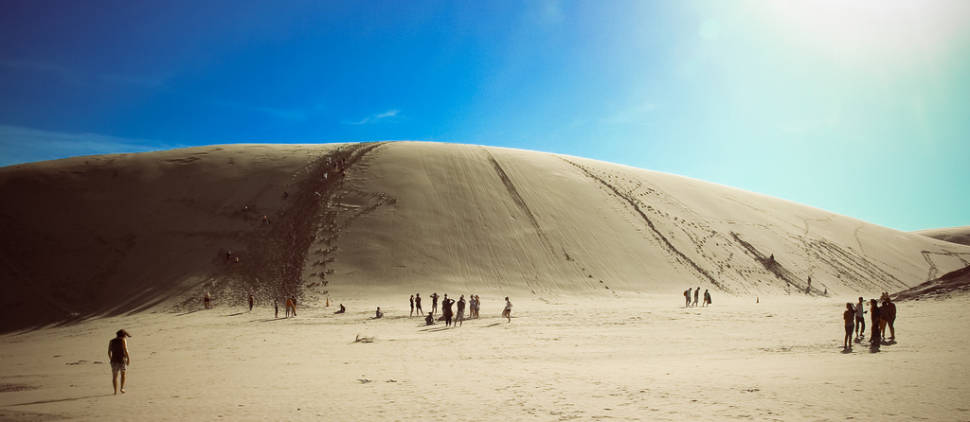 Body Board Down the Sand Dunes in New Zealand - Best Time