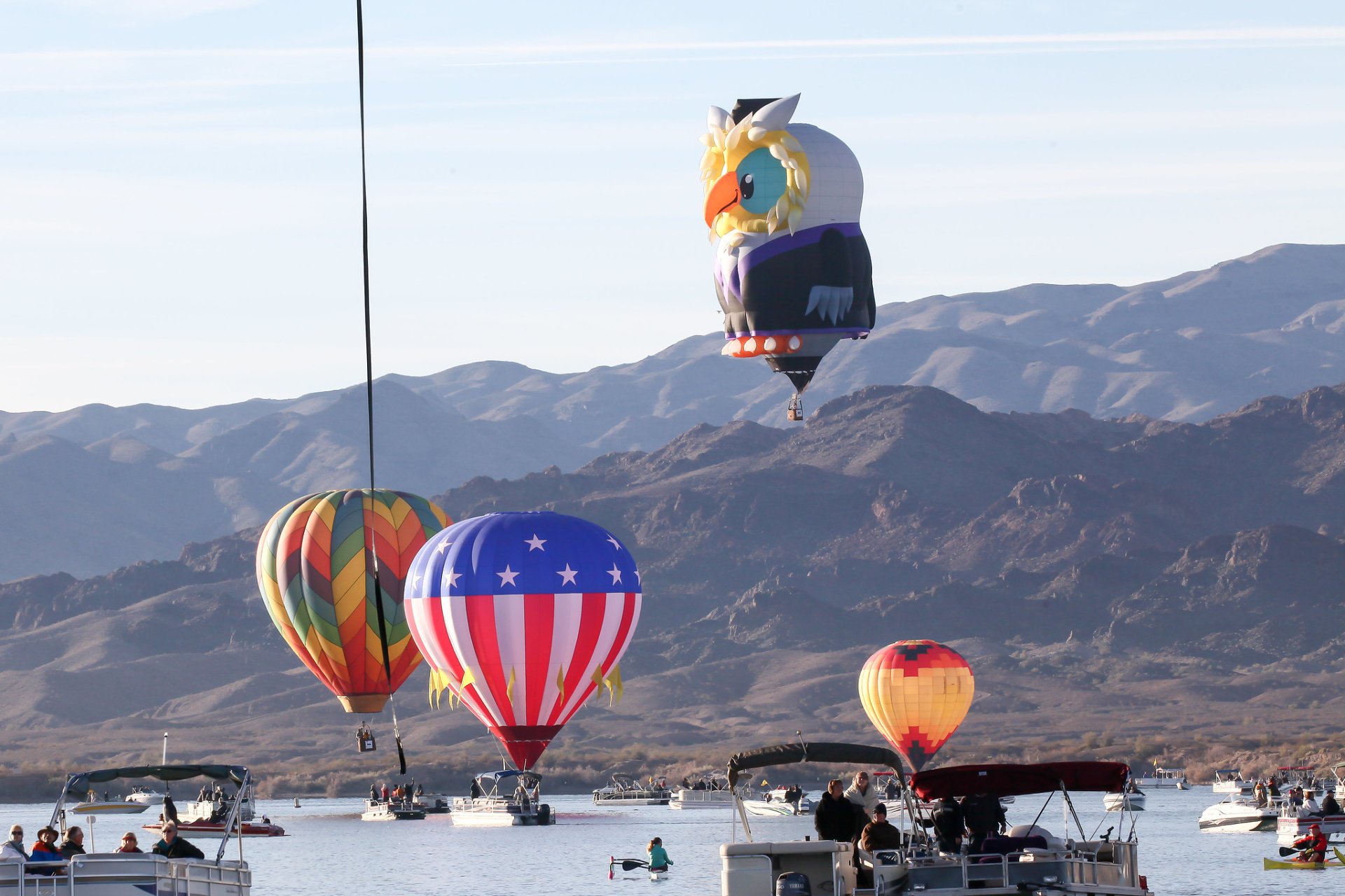 Colorful hot air balloons flying high in the sky during balloon festivals 2025.