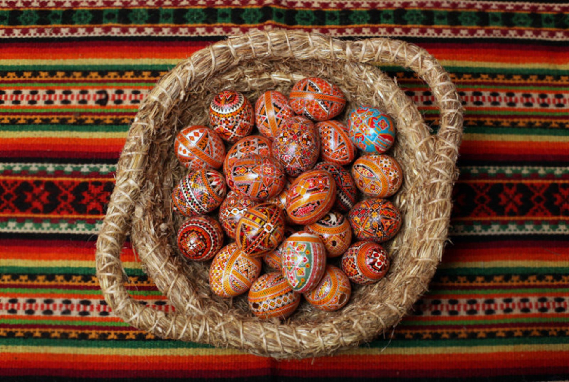 Lviv, Ukraine. 06th Apr, 2023. A young woman makes Easter eggs. A young  woman in traditional Ukrainian clothing makes Easter eggs using ancient  technology. Pysanka is an ancient tradition, one of the