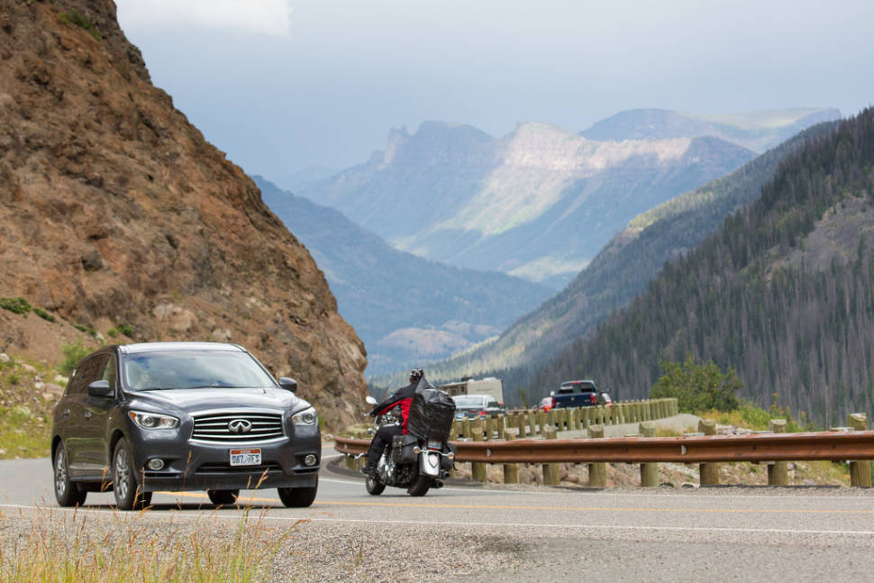 Visitors driving on East Entrance Road up Sylvan Pass
